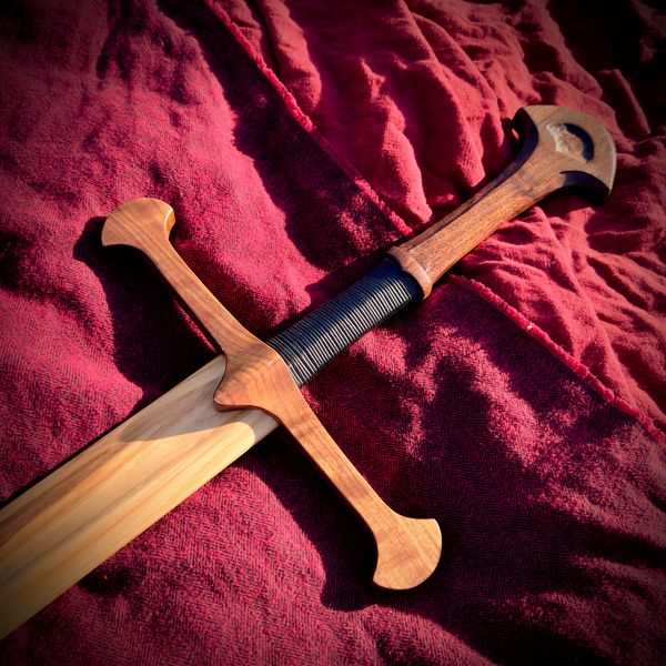 Handcrafted wooden Anduril sword with a dark wrapped grip