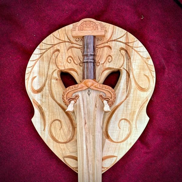 Wooden sword inspired by Eowyn’s blade, crafted from maple and cherry